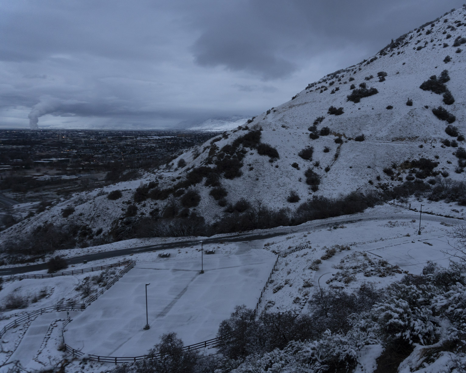 The town visible beyond the mountain and parking lot at slate canyon all covered in recent snow